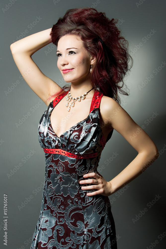 attractive young woman in color dress smiling attractive young woman in color dress smiling