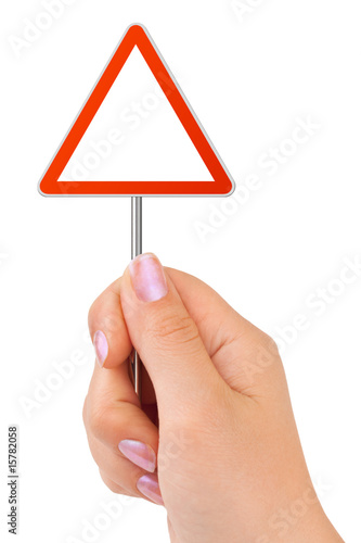 Triangle traffic sign in hand