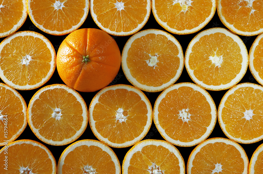 oranges halves background with one whole on black oranges halves background with one whole on black