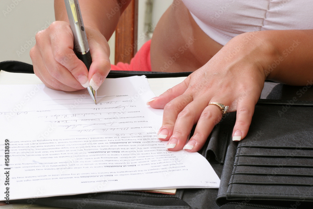 Woman's hands writing Woman's hands writing