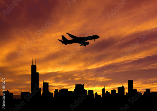 plane arriving in Chicago at sunset