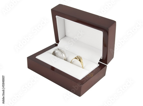 two wedding rings in a box isolated on white
