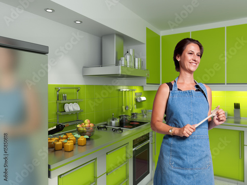 Smiling cook in a modern ki...