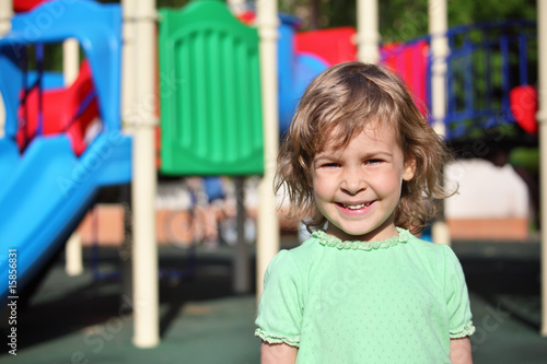 Little smiling girl on playground