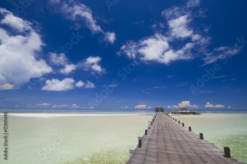 Walkway to tropical island resort