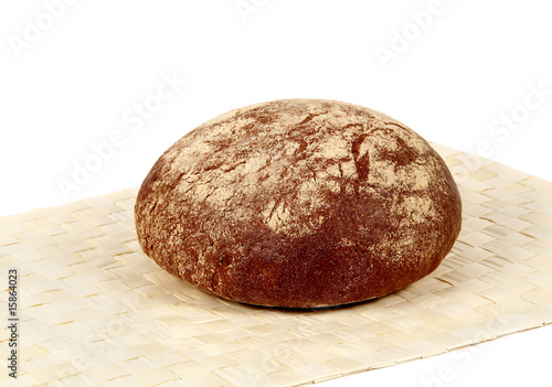 An ovall loaf of rye bread photo