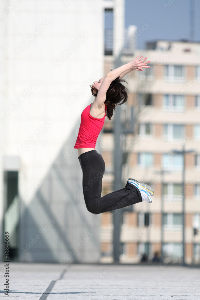 Girl jumping, urban life