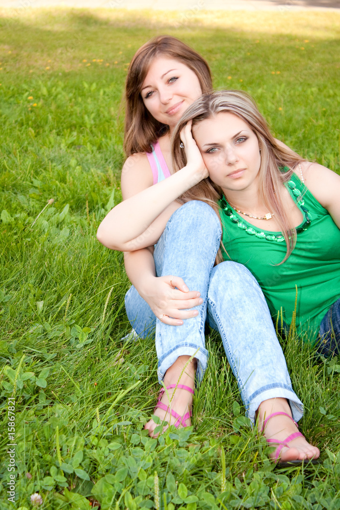 Fototapeta premium Two friends on grass background