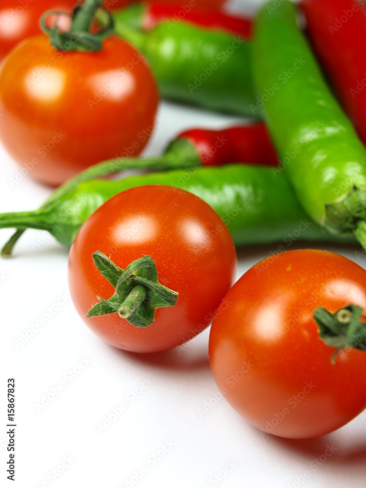 green chilli peppers with cherrys tomatoes green chilli peppers with cherrys tomatoes