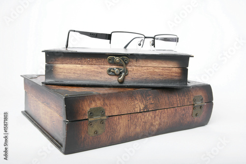 Wooden box and glasses isolated on a white photo