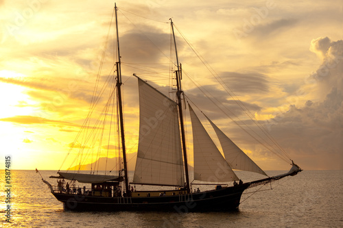 old sailing vessel at sunset