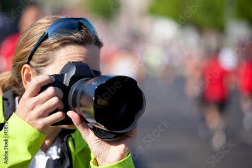 female photographer close taking pictures