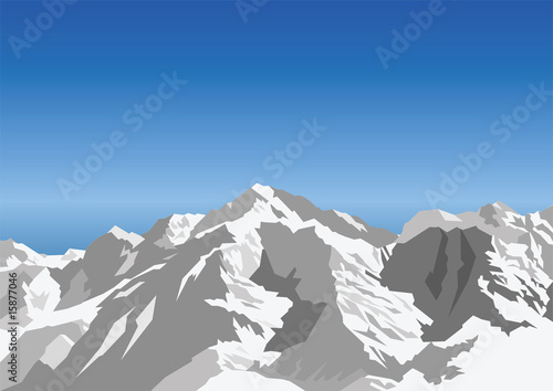Snow capped mountain against a blue sky
