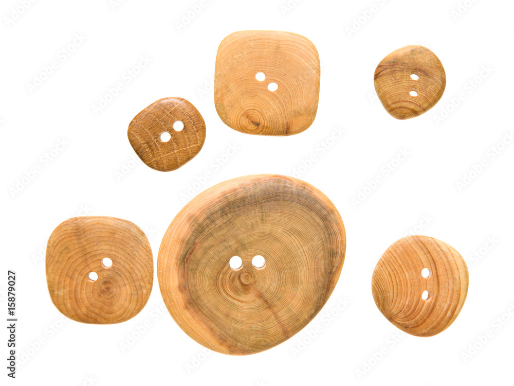 wooden buttons of different sizes, isolated