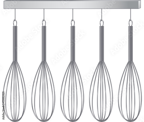 Wire Whisks hanging from Rack