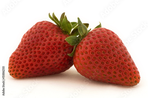 Two strawberries set against a white background