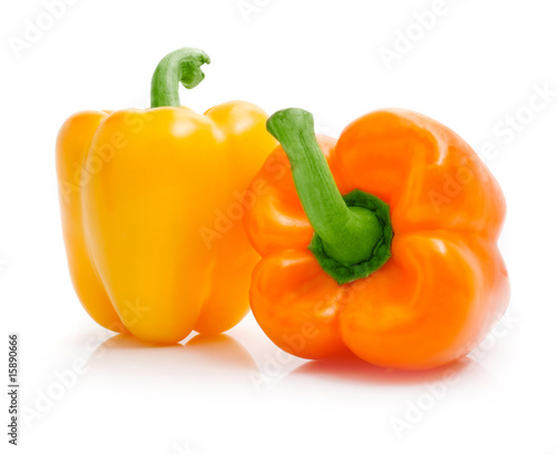 fresh yellow orange peppers isolated on white