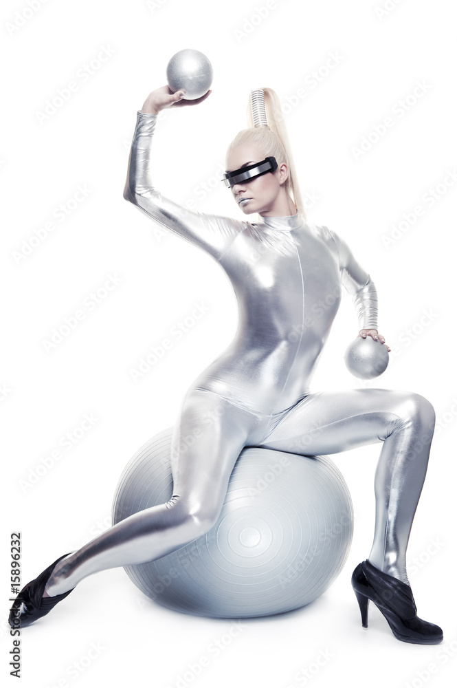 Beautiful cyber woman sitting on a silver ball Beautiful cyber woman sitting on a silver ball
