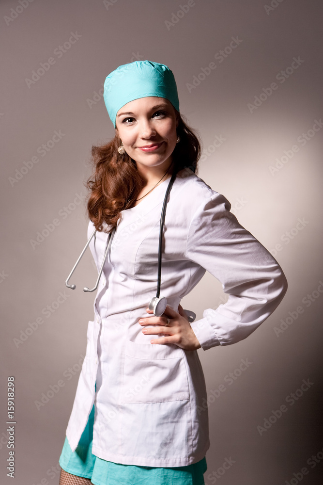 pretty young nice doctor in whites looking forward isolated pretty young nice doctor in whites looking forward isolated