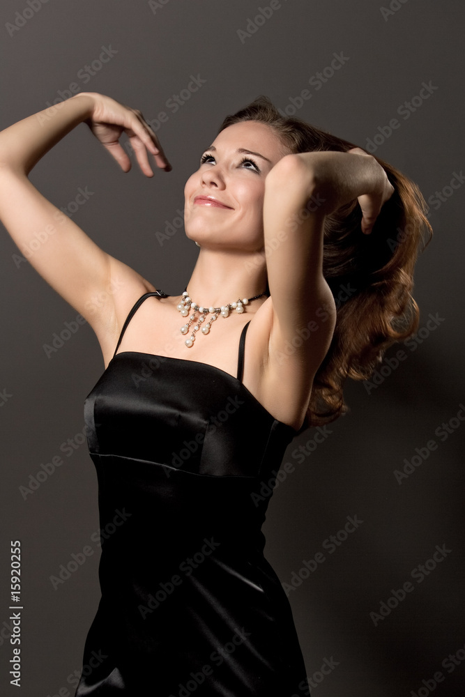 extravagant young girl with lifted hand isolated over gray extravagant young girl with lifted hand isolated over gray