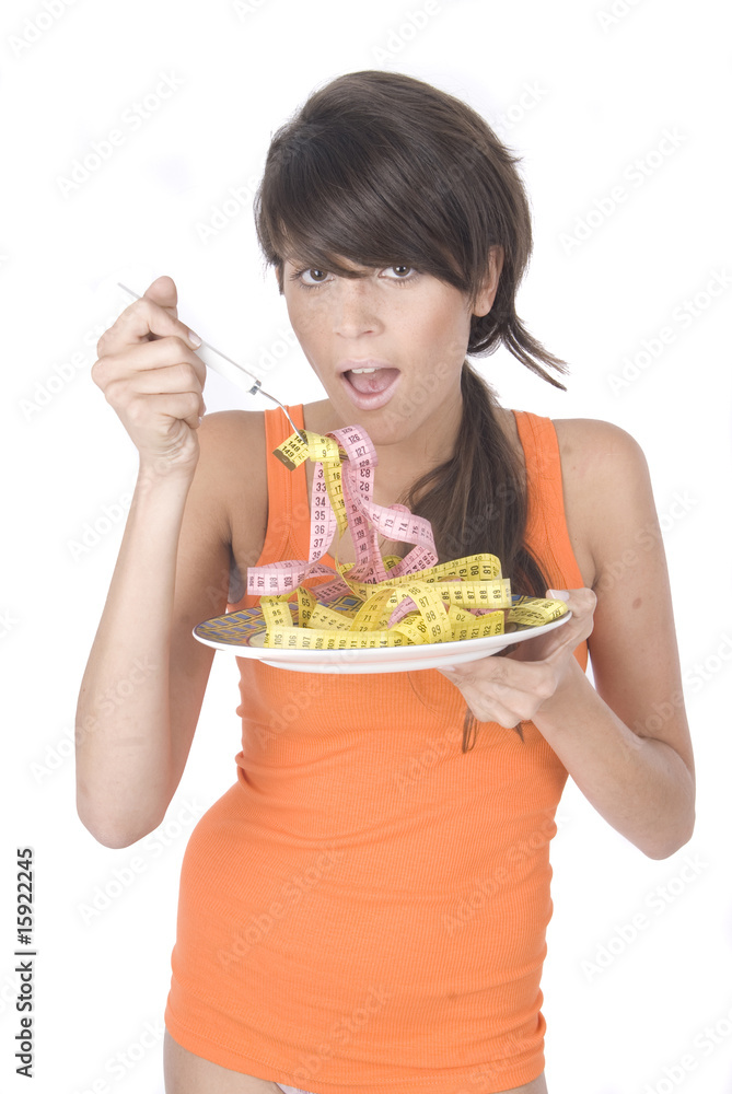 woman eating a tape measures in white woman eating a tape measures in white