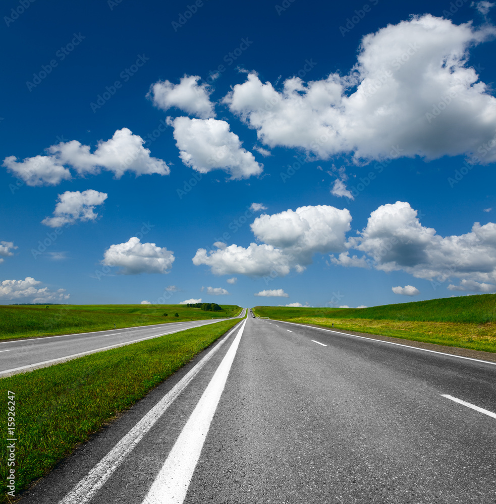 landscape with road and cloudy blue sky landscape with road and cloudy blue sky
