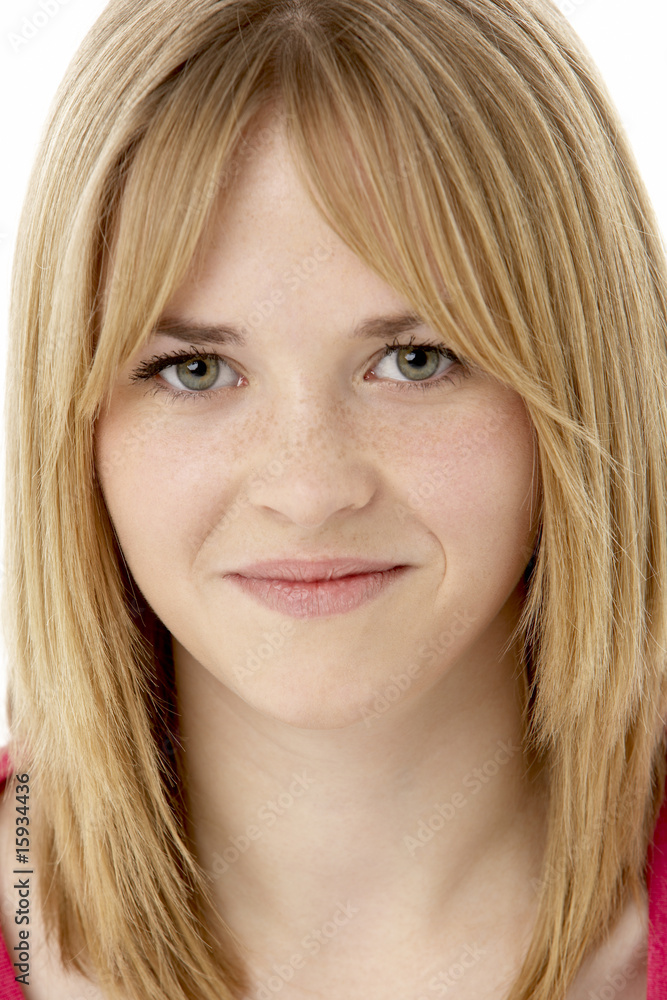 Studio Portrait Of Smiling Teenage Girl