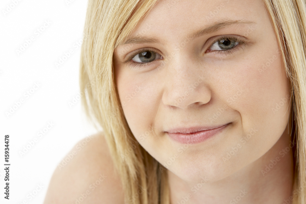 Studio Portrait Of Smiling Teenage Girl