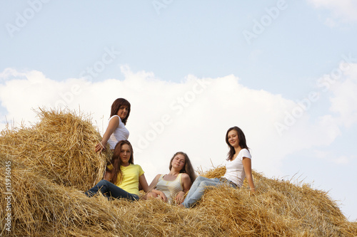 Four girls on hay