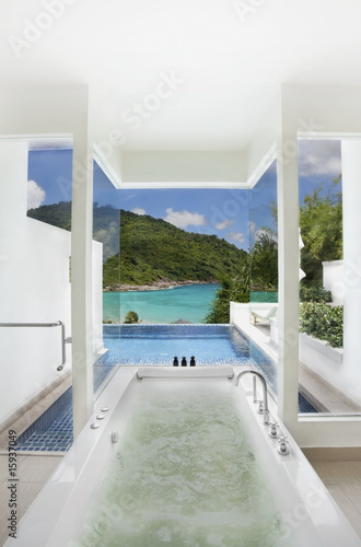 luxury bathroom closes swimming pool with sea view