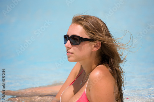 attractive young woman at a pool