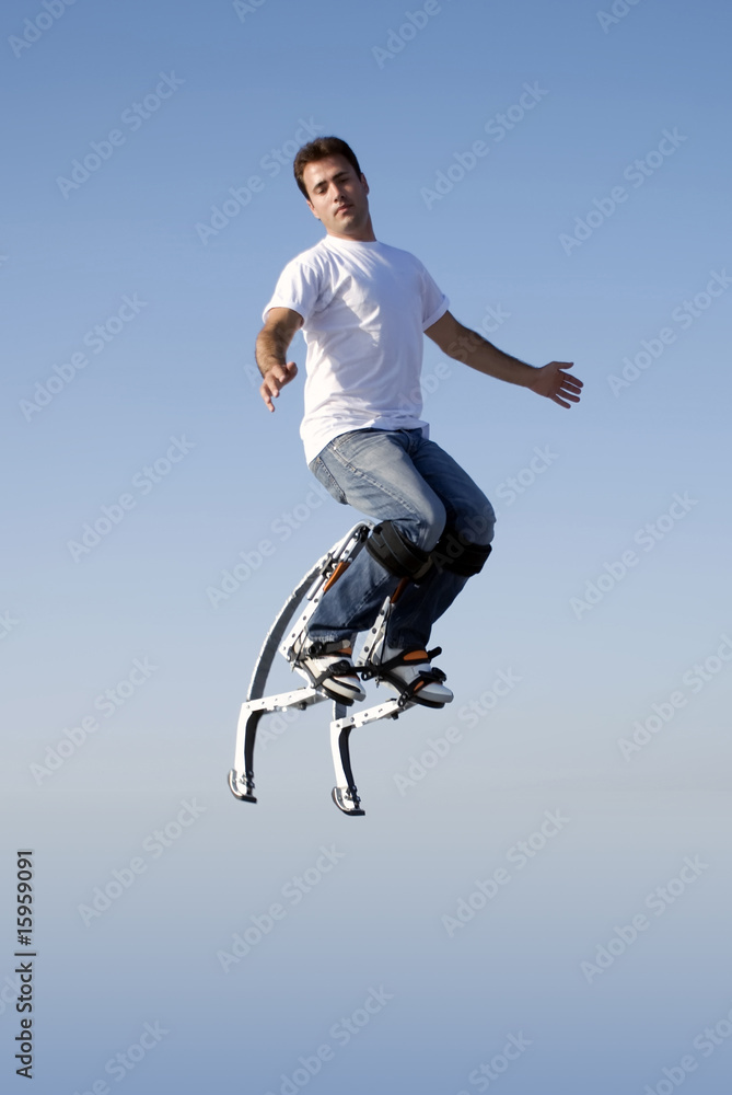 a young man jumping high in the sky a young man jumping high in the sky