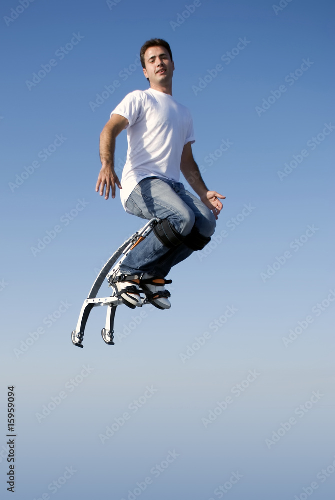 a young man jumping high in the sky a young man jumping high in the sky