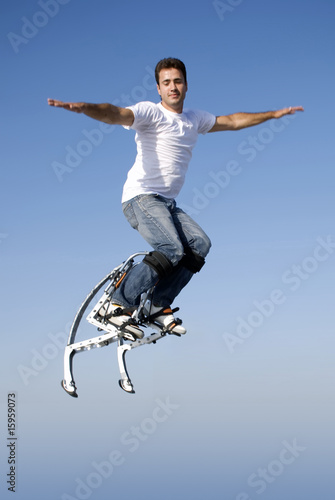a young man jumping high in the sky