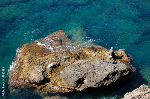 Tableau sur toile Fisherman On A Rock
