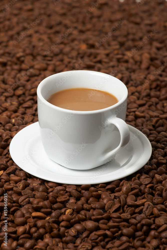 Cup with coffee, costing on coffee grain Cup with coffee, costing on coffee grain