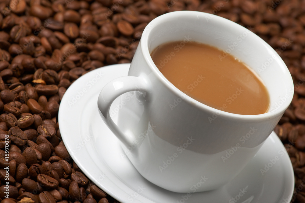 Cup with coffee, costing on coffee grain Cup with coffee, costing on coffee grain