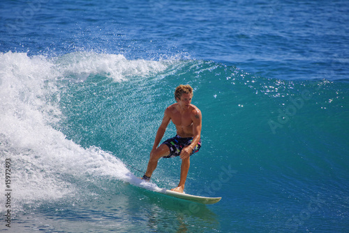 Photography young man surfing at Point Panic, Hawaii