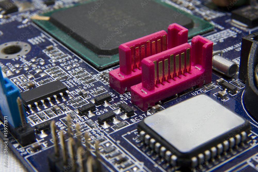 PC motherboard detail with SATA slots. PC motherboard detail with SATA slots.