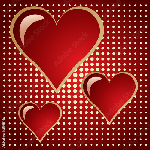 three of bright red hearts on doted background