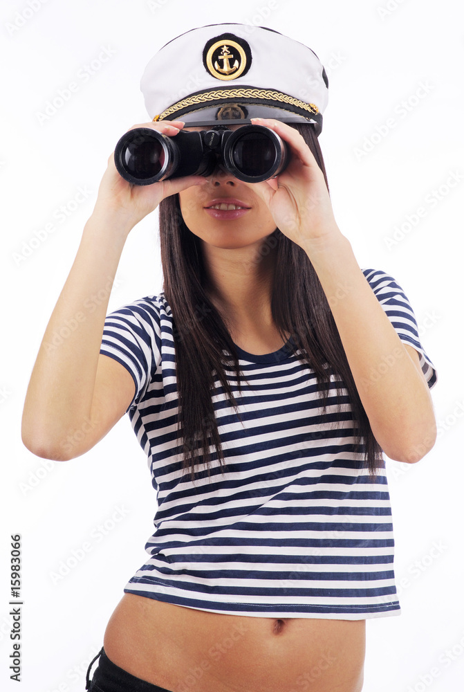 Close-up portrait of a woman as a sea captain holding binocular Close-up portrait of a woman as a sea captain holding binocular