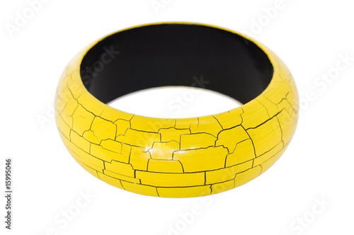 Wooden yellow bracelet isolated on a white background