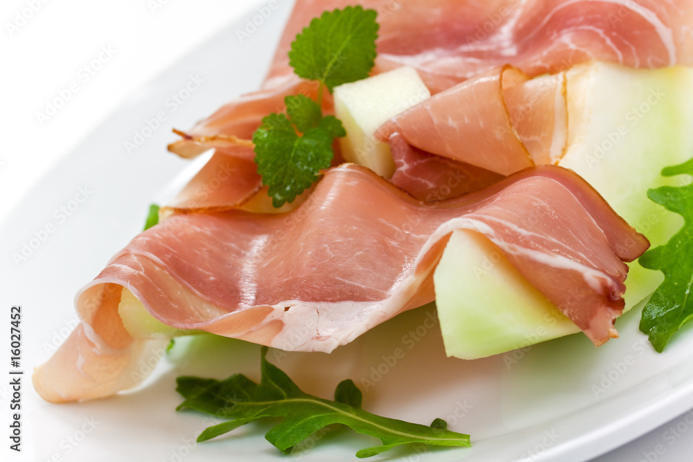 Prosciutto di Parma ham and three slice of melon Prosciutto di Parma ham and three slice of melon