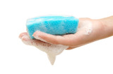 Hand and kitchen sponge in soapsuds