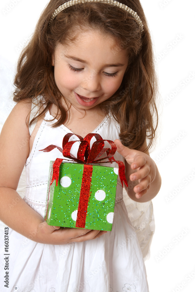 Little girl with a christmas or other present Little girl with a christmas or other present