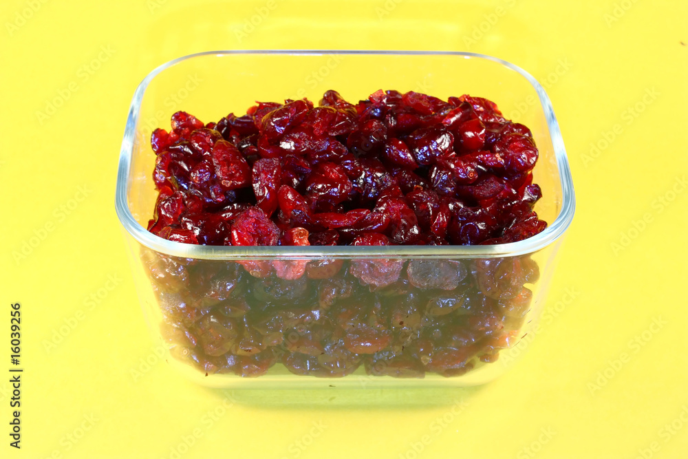 Dried cranberries in glass container Dried cranberries in glass container