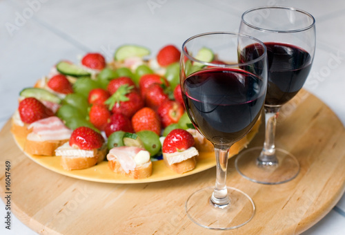 Romantic dinner for two. Red wine, delicious canapes and fruits