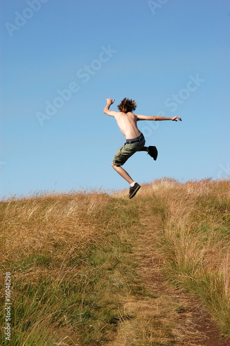Young man jumping for joy