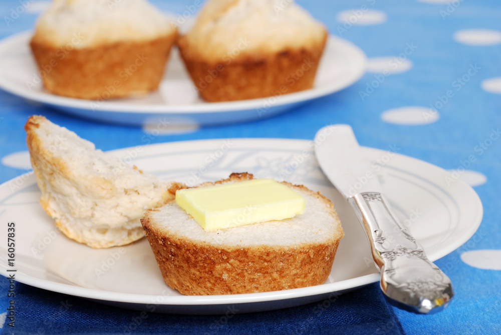 tea biscuit with butter on a plate tea biscuit with butter on a plate