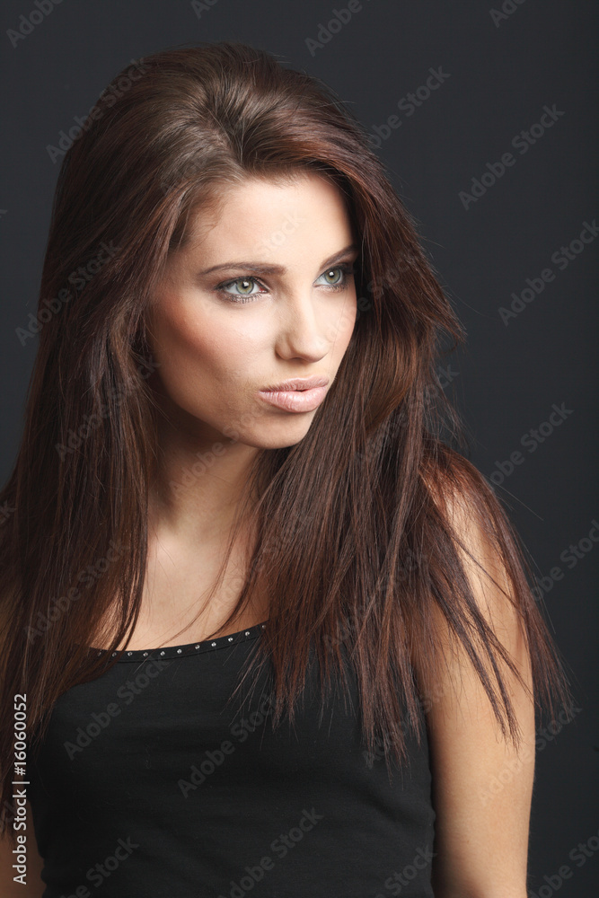 Attractive young fashion model posing in black dress. Attractive young fashion model posing in black dress.